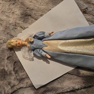 Elegant Blue and Gold Doll with Crown